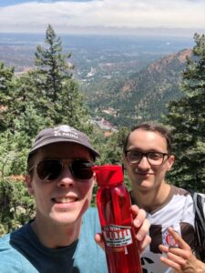 Two happy customers with Red Wing Motel water bottle atop the Manitou incline